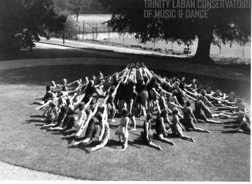 Photograph of participants dancing outside in a movement choir at the Moreton Hall Modern Dance Holiday Course, 1942.