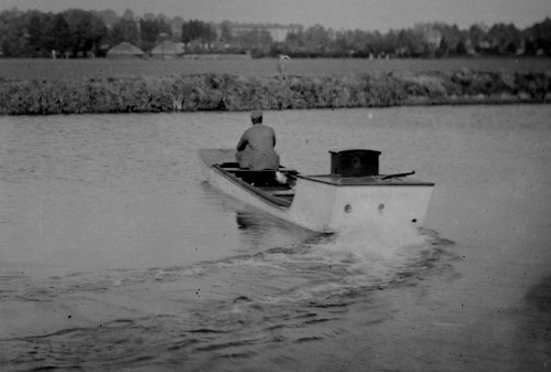 Image from a glass plate negative showing the rear view of the first all British motor boat, 1894. 