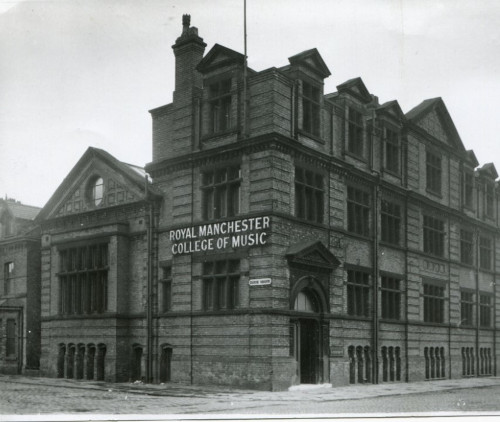 Black and white photograph of the exterior of the Royal Manchester College of Music building.